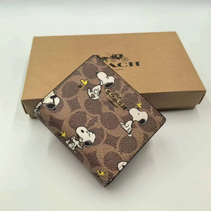 Coach X Peanuts Snap Wallet In Signature Canvas With Snoopy Print CBN32